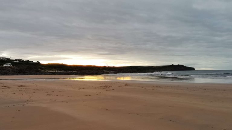 Sunrise at serene Australian beach.