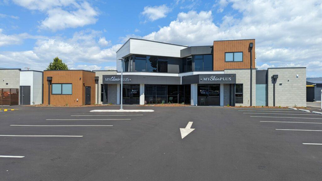 Modern clinic exterior with parking, Australia.